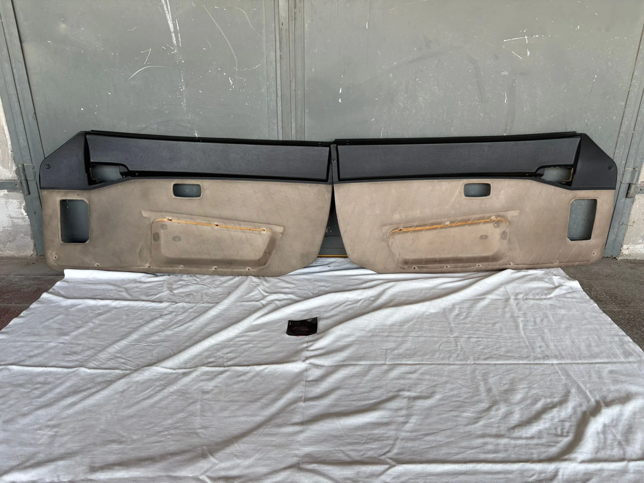 Pair Of Porsche 944 black/beige Porsche scripted fabric door cards 94455501701 94455501801 used, very nice condition.