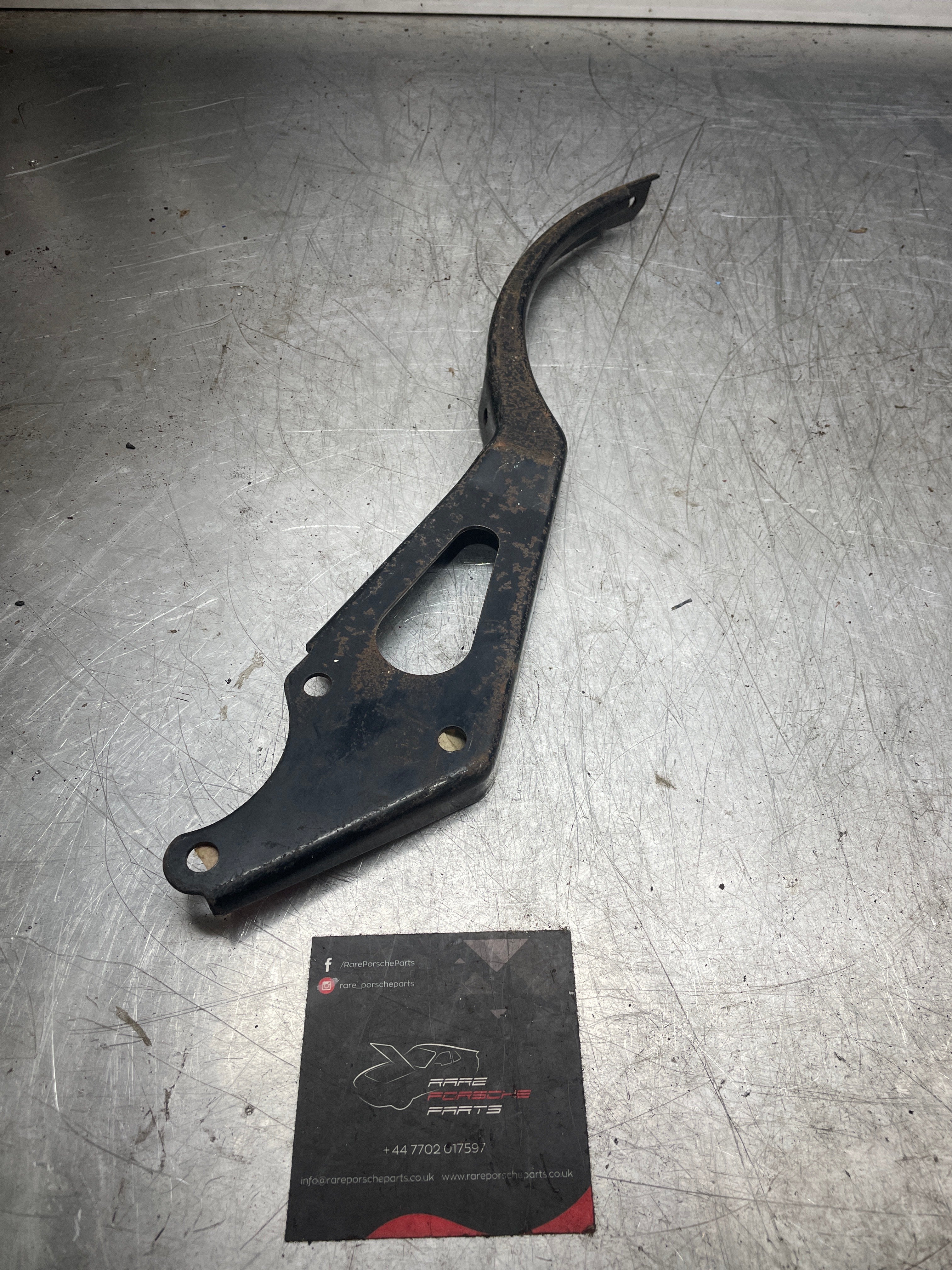 Porsche 924 early exhaust bracket, new, old stock, 477253255B - Image 2