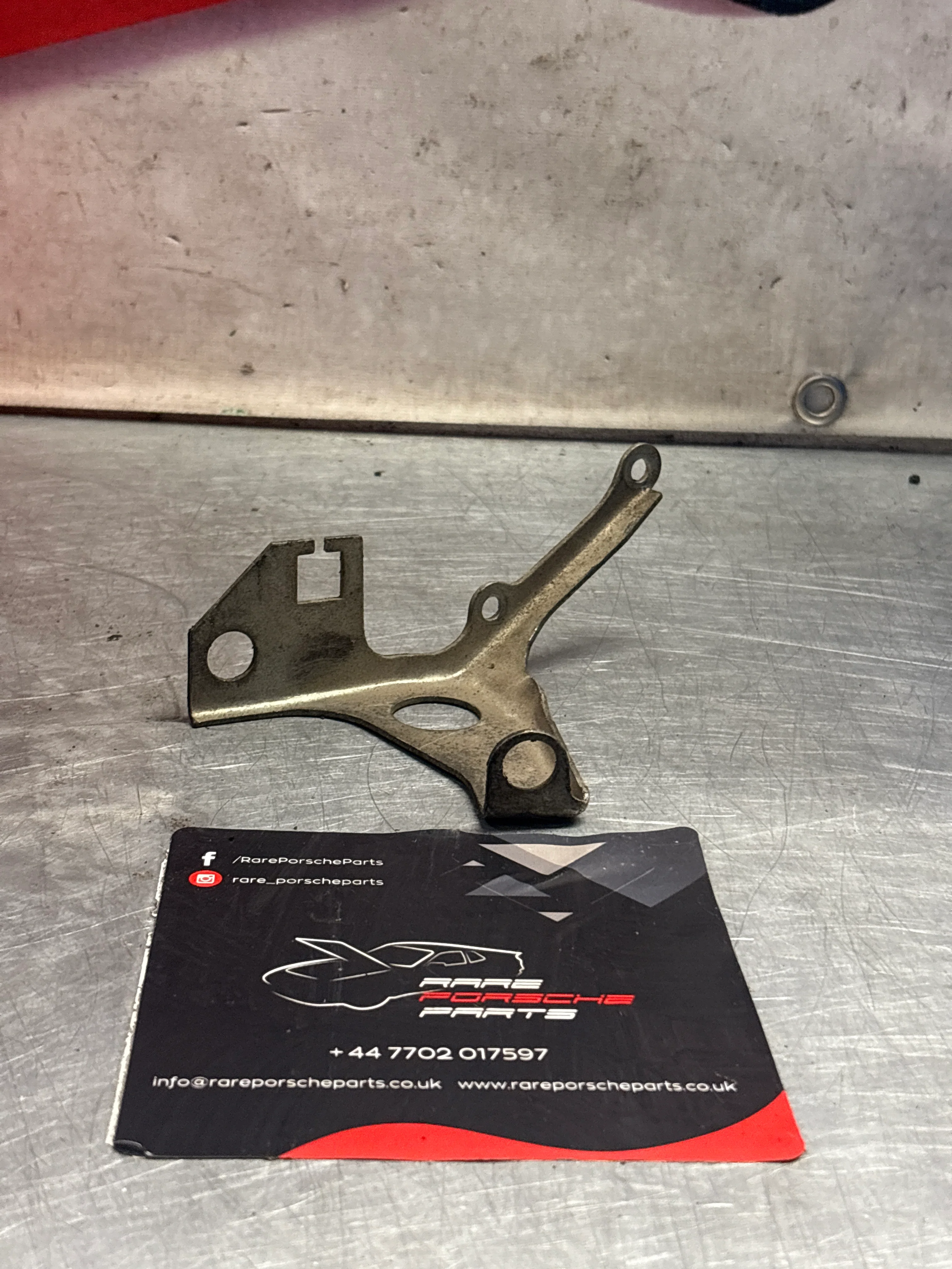 Porsche 928 intake flow meter cable guide bracket, used 92811021703